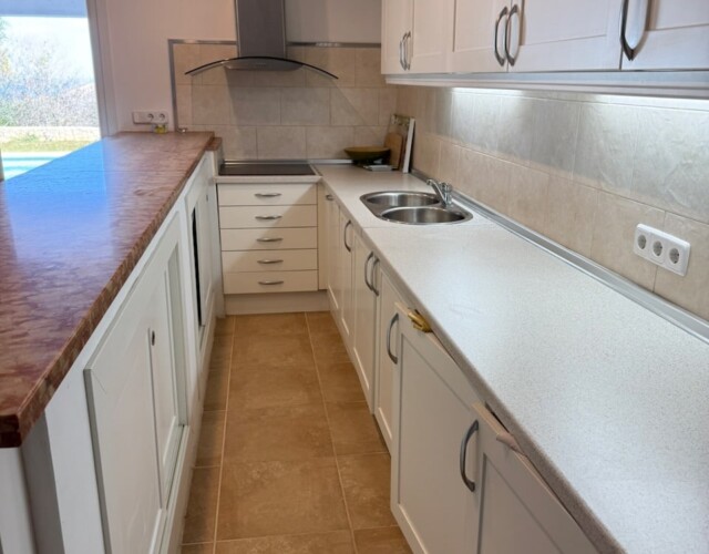 Lower level kitchen area with patio and pool