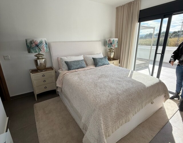 Master bedroom on second level with deck overlooking pool
