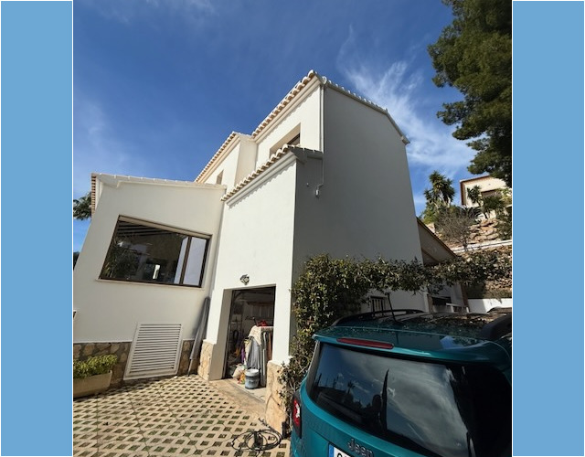 Driveway with garage and 2 car outdoor parking